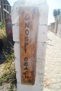 Sign showing the way to Gnospi swimming point